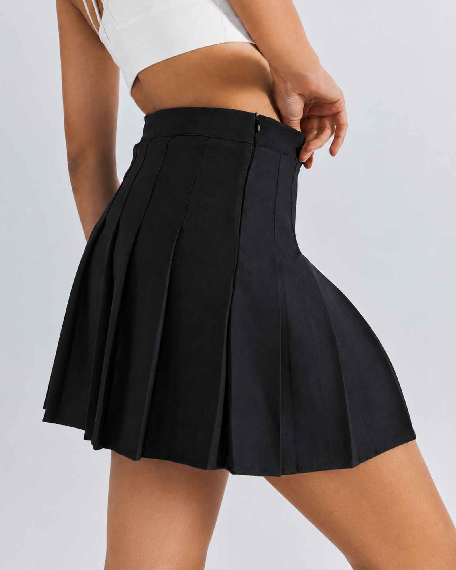 Side view of a black pleated skirt